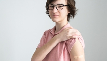 Boy with bandage on shoulder