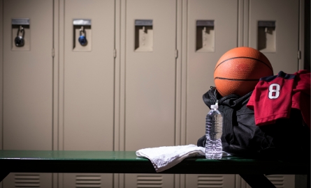 Set of lockers with basket ball kit in front.
