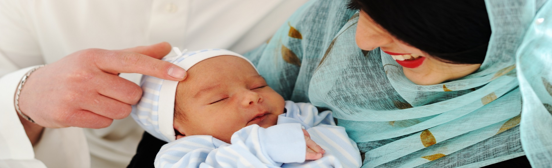 Muslim woman holding her newborn